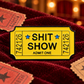 Shit Show Ticket Pin enamel pin in a styled lifestyle setting