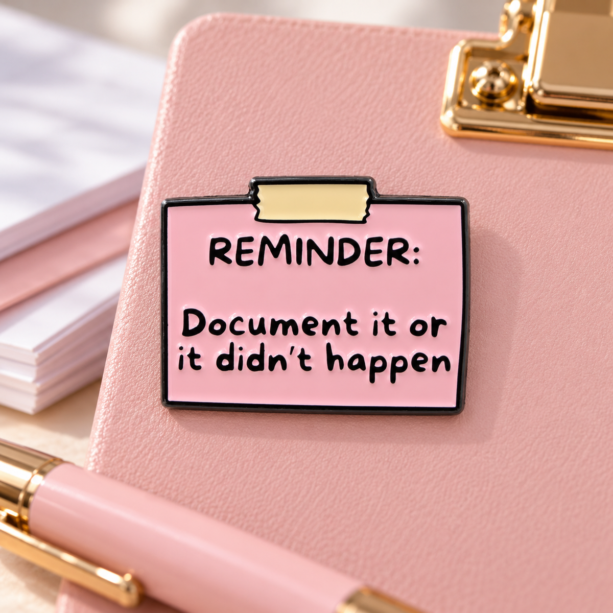 Document It Or It Didn't Happen Reminder Quote Pin enamel pin in a styled lifestyle setting