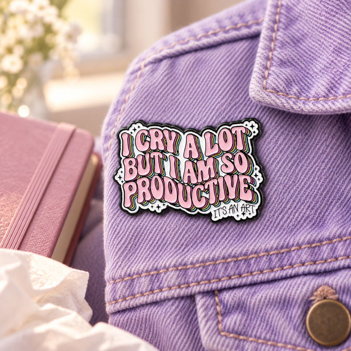 I Cry A Lot Pin enamel pin in a styled lifestyle setting