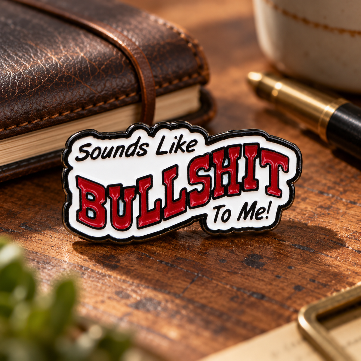 "Sounds Like BULLSHIT To Me!" Pin enamel pin in a styled lifestyle setting