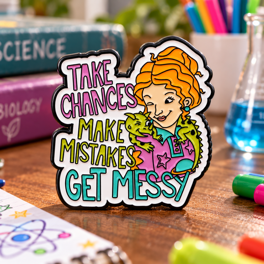 Take Chances, Make Mistakes, Get Messy Pin enamel pin in a styled lifestyle setting