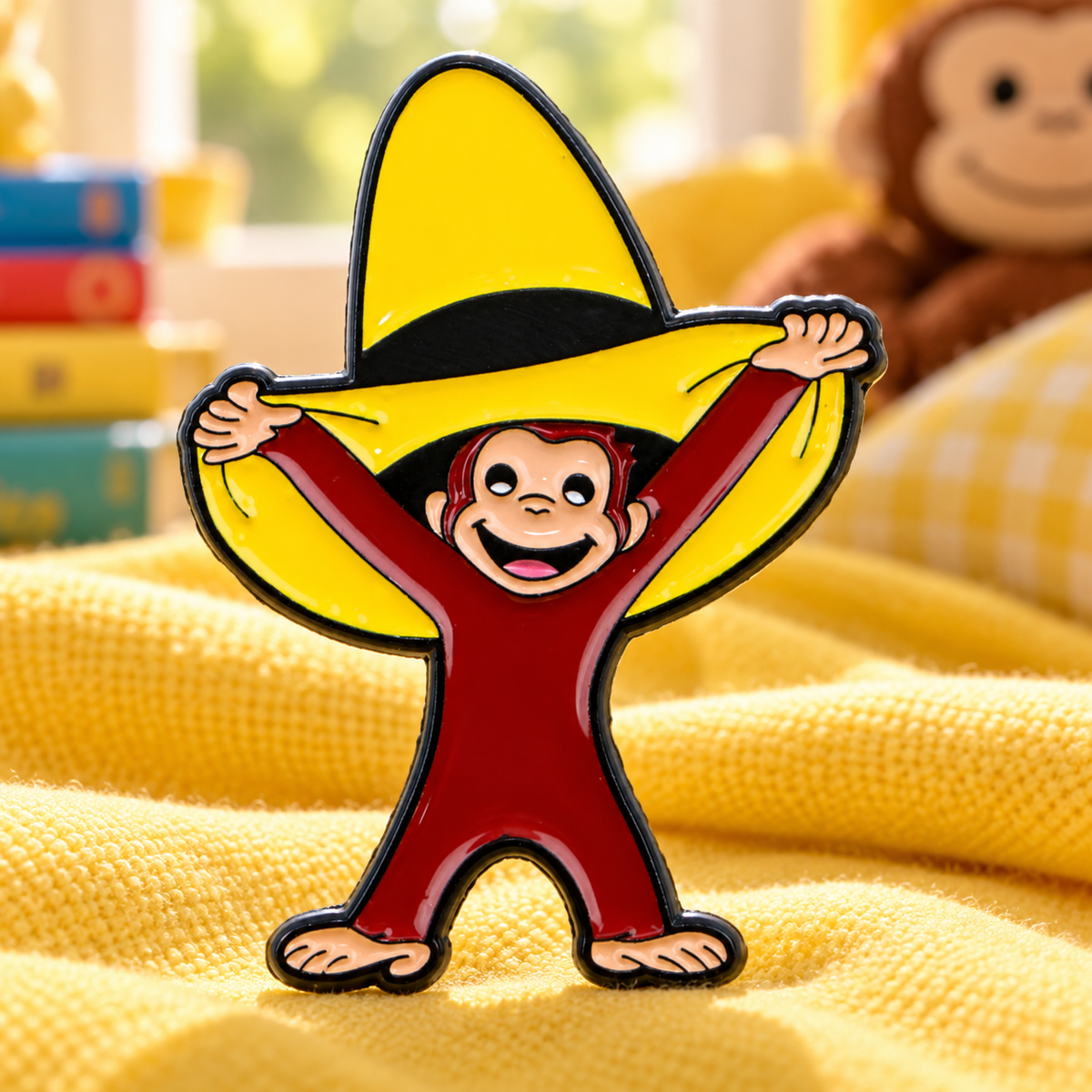 Curious George Monkey Pin enamel pin in a styled lifestyle setting