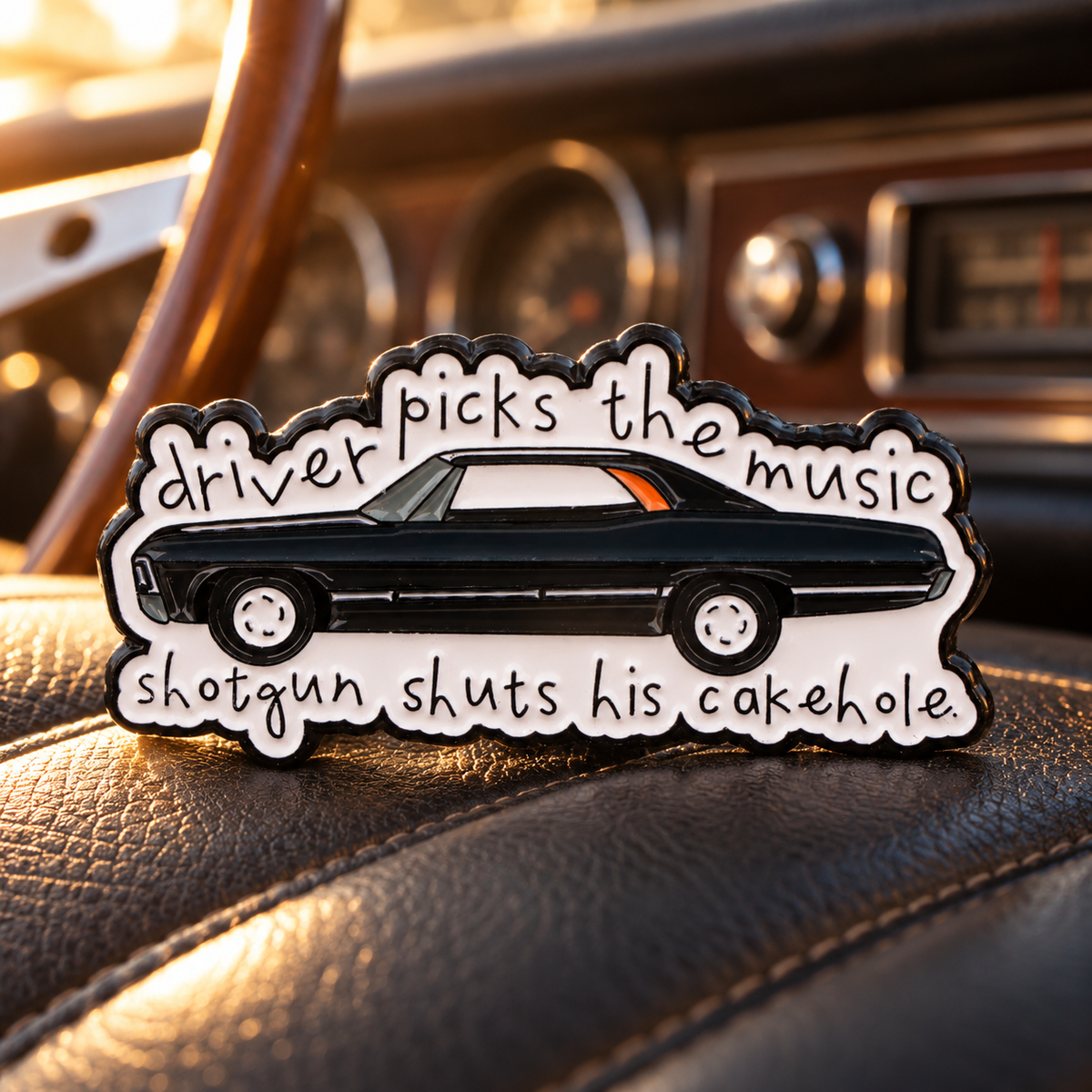 Driver picks the music, shotgun shuts his cake hole! Pin enamel pin in a styled lifestyle setting