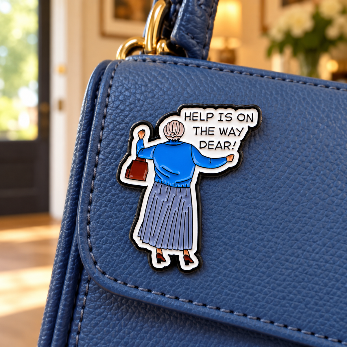Help is on the way dear enamel pin on a blue handbag