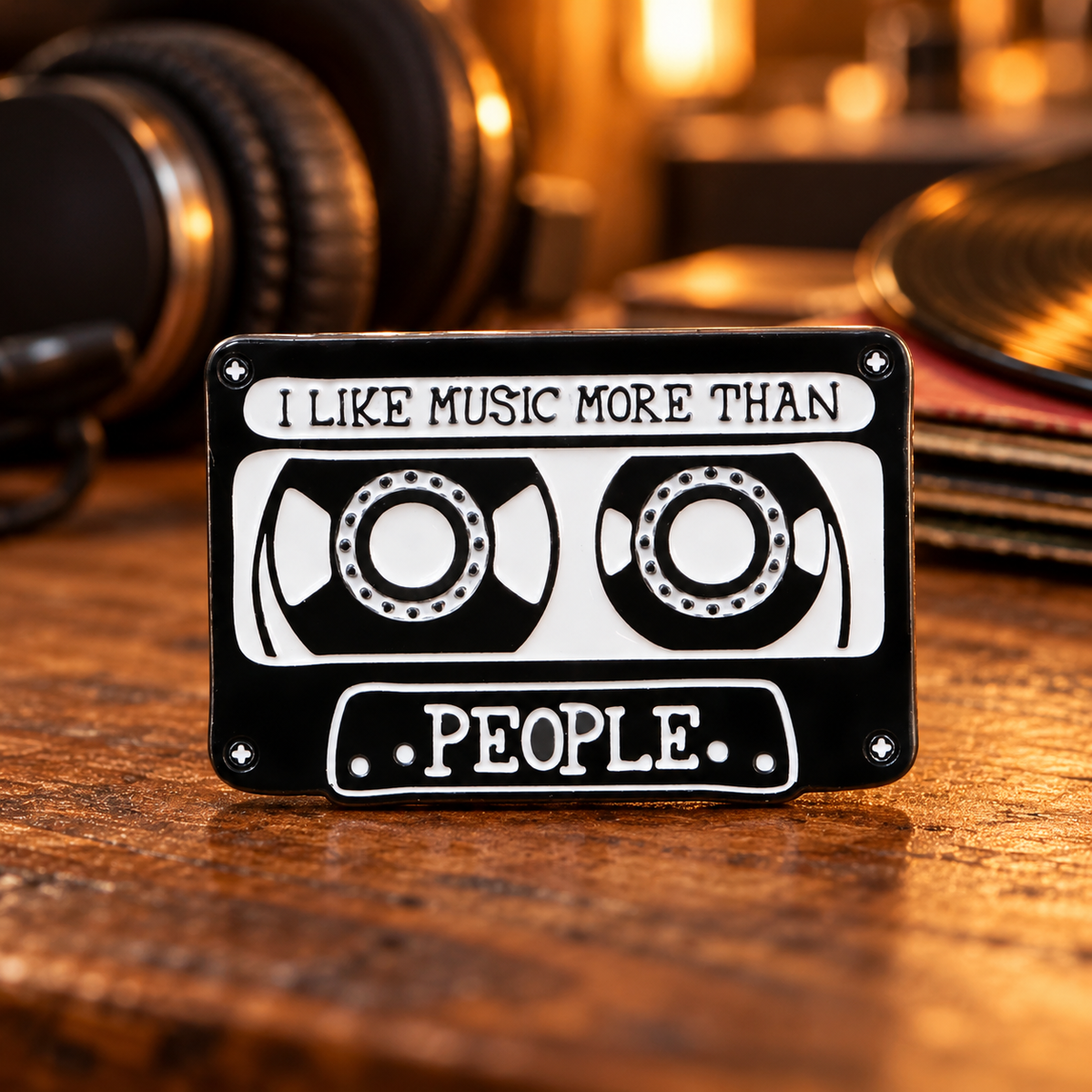 I Like Music More Than People cassette enamel pin in a music studio