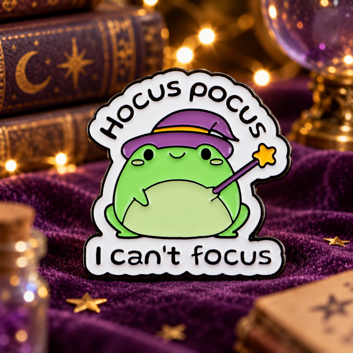 Hocus Pocus I Can't Focus magician frog enamel pin in a whimsical study
