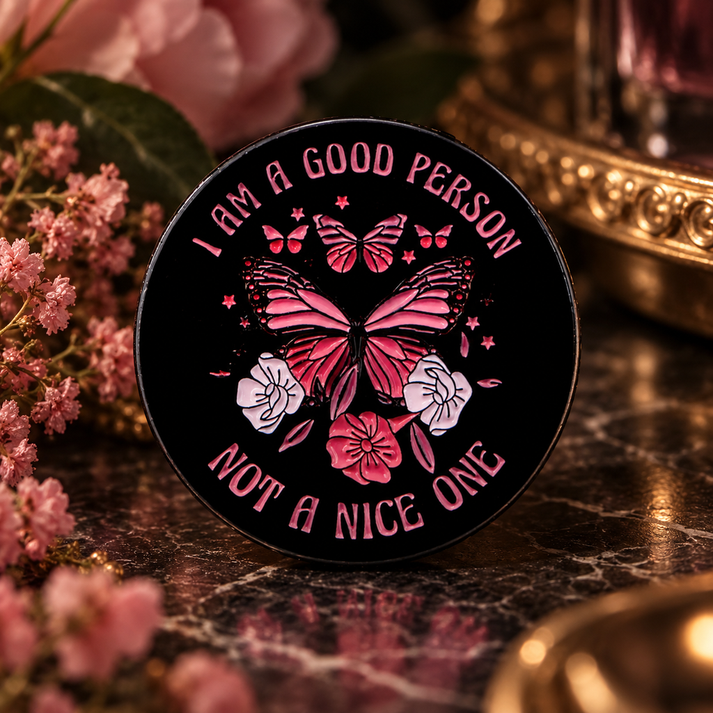 I'm A Good Person Not A Nice One enamel pin in a dark floral setting