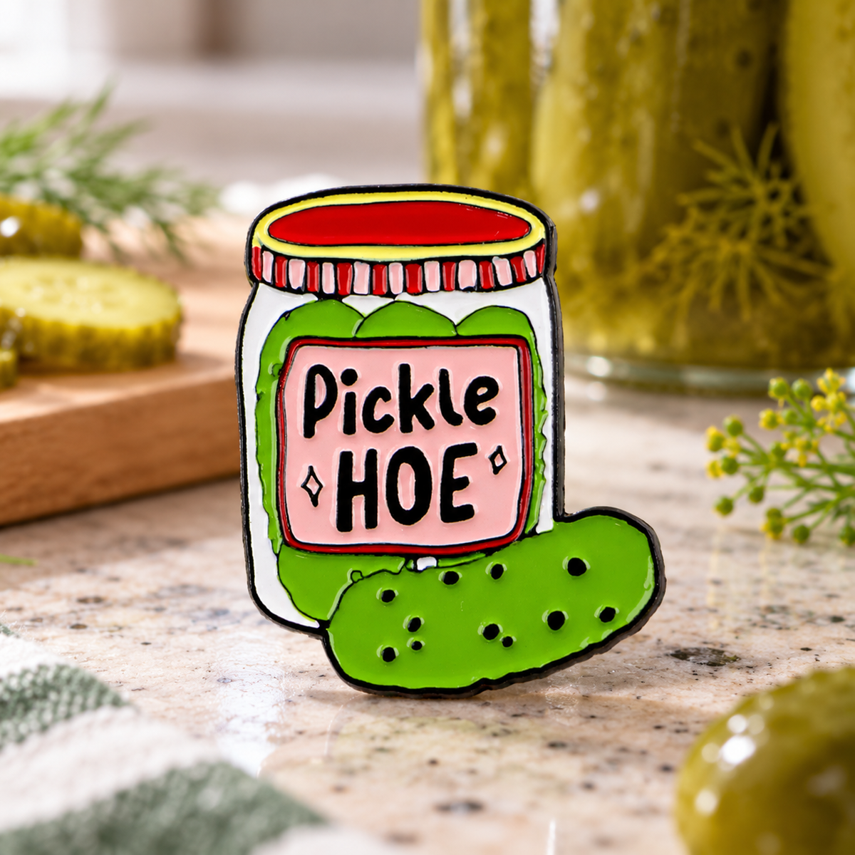 Pickle Hoe Jar enamel pin in a playful kitchen setting
