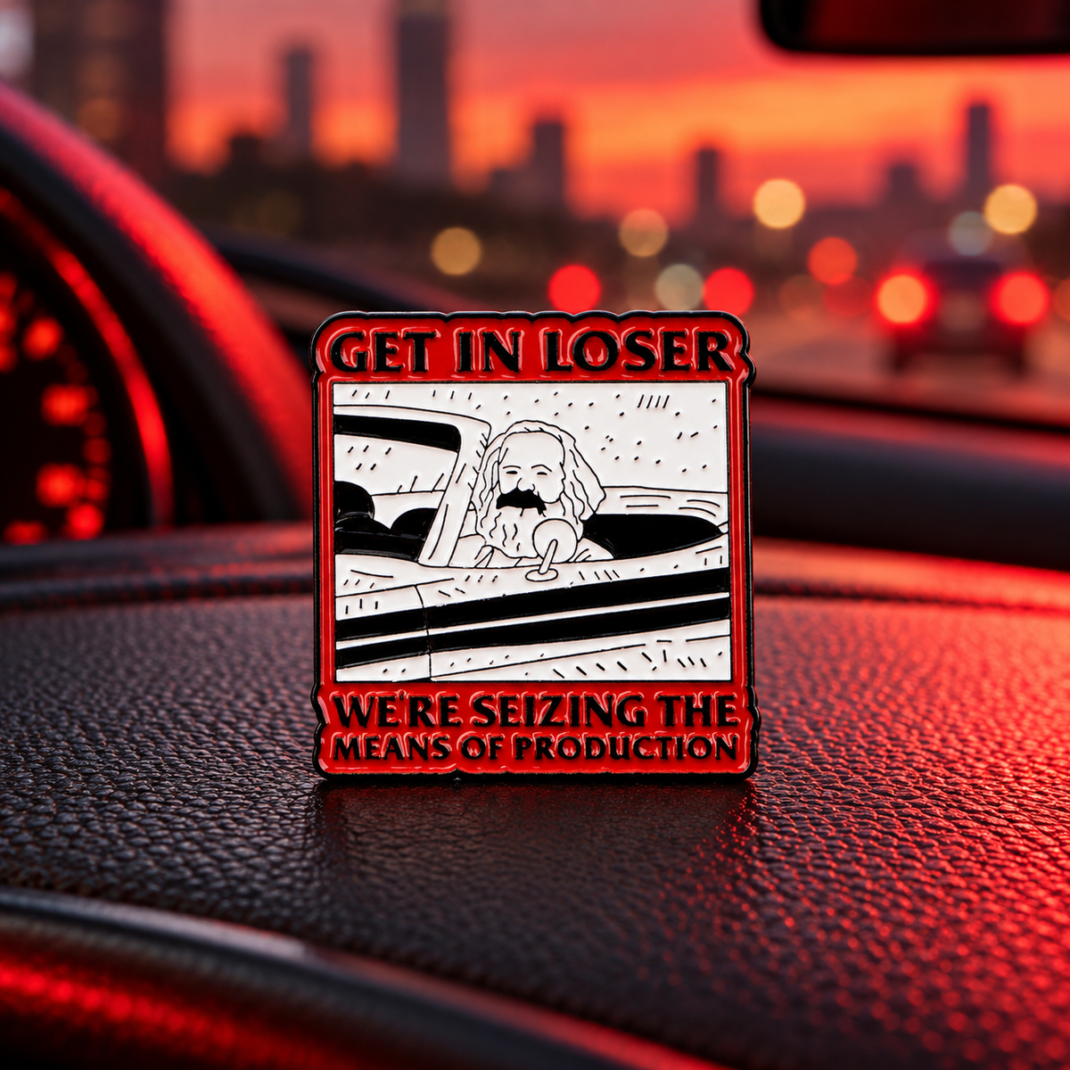 Get In Loser Karl Marx enamel pin in a cinematic car setting