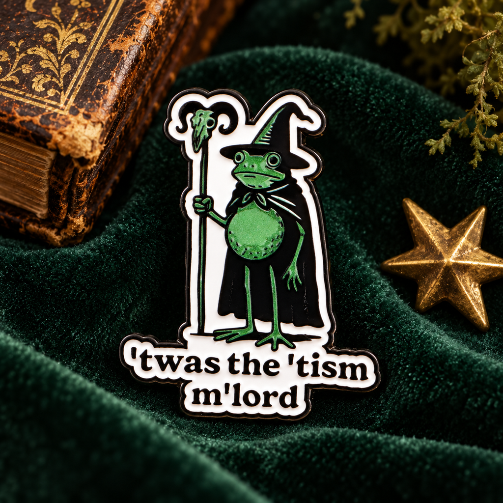 'Twas The 'Tism M'Lord Frog Pin displayed in a styled lifestyle setting