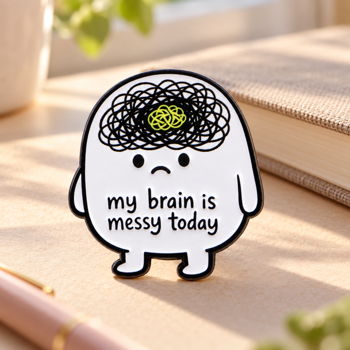My Brain Is Messy Today enamel pin on a calm sunlit desk