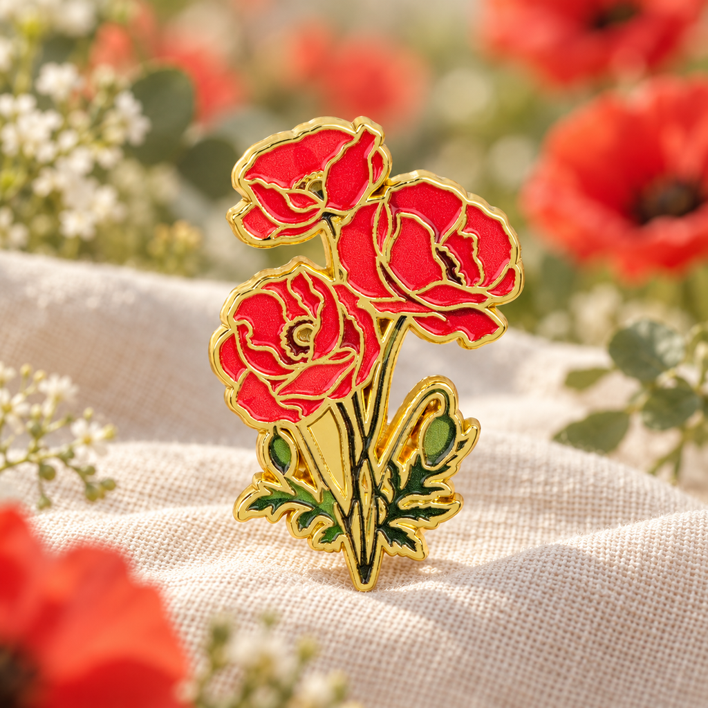 Red poppy flower enamel pin on a linen botanical backdrop