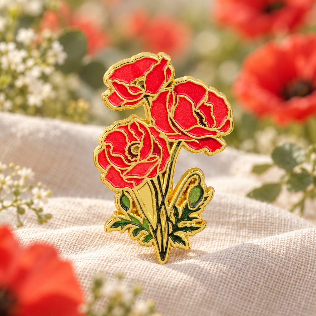Red poppy flower enamel pin on a linen botanical backdrop
