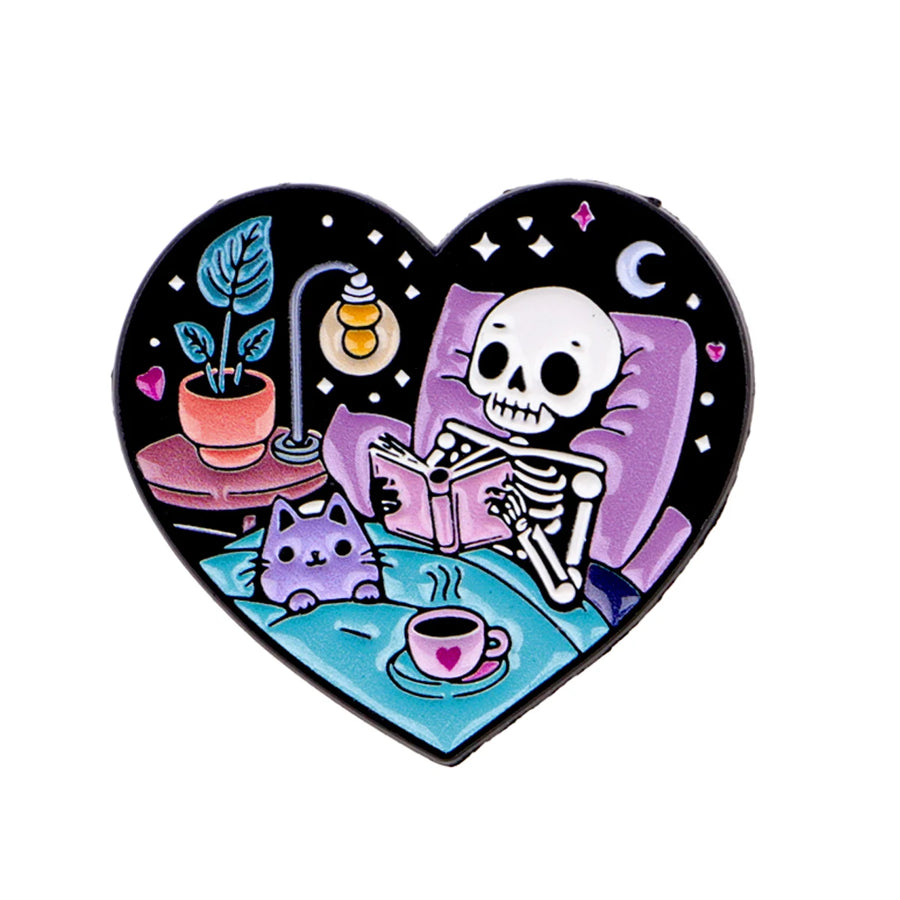 Skeleton Reading with a Cat Heart Pin