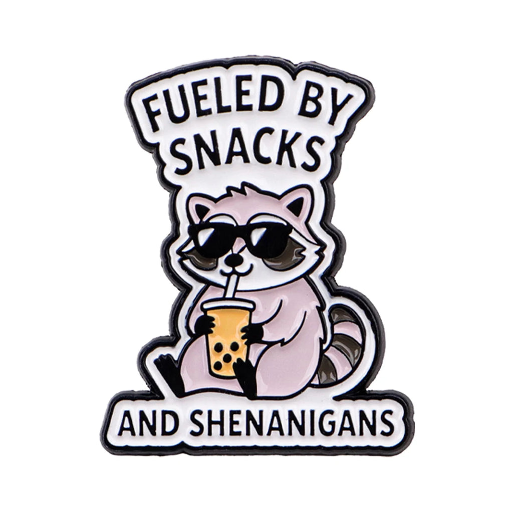 "FUELED BY SNACKS  AND SHENANIGANS" Pin
