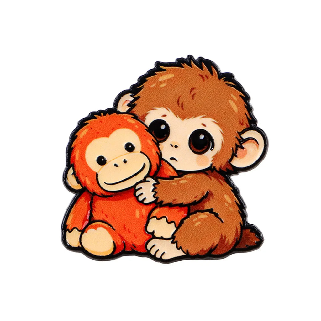 Baby Monkey Hugging a Toy Pin