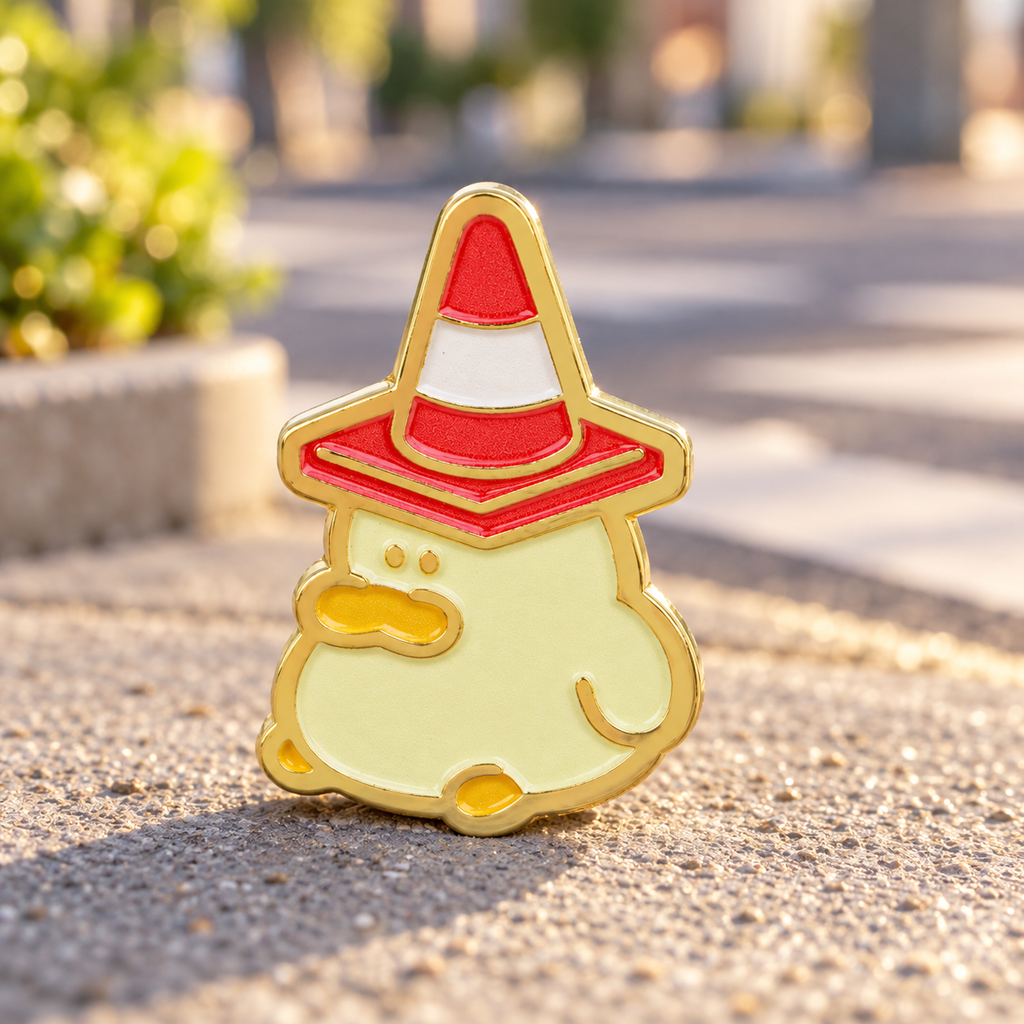 Traffic Cone Hat Duck Pin on a sunny city sidewalk