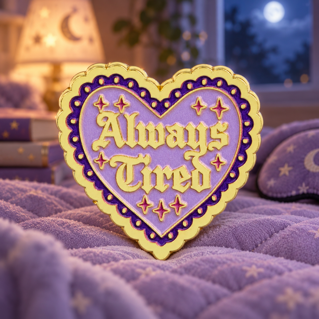 Always Tired Purple Heart enamel pin in a dreamy moonlit bedroom