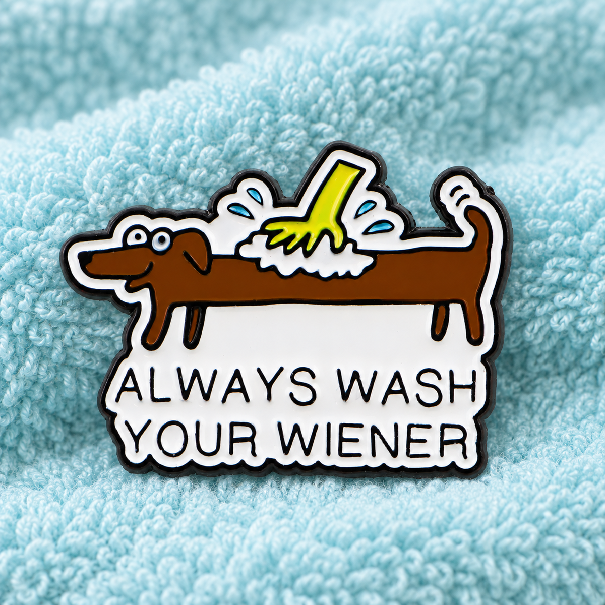 Always Wash Your Wiener dachshund enamel pin on aqua towel