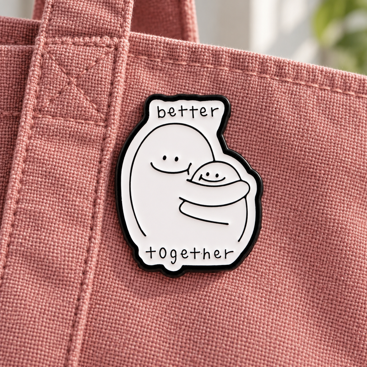 Better Together enamel pin on a dusty rose canvas tote