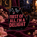 Black cat enamel pin on plum velvet at night