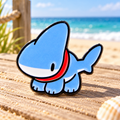 Blue Walking Shark Pin on a sunny beach boardwalk