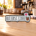 But First Coffee enamel pin on a warm café table