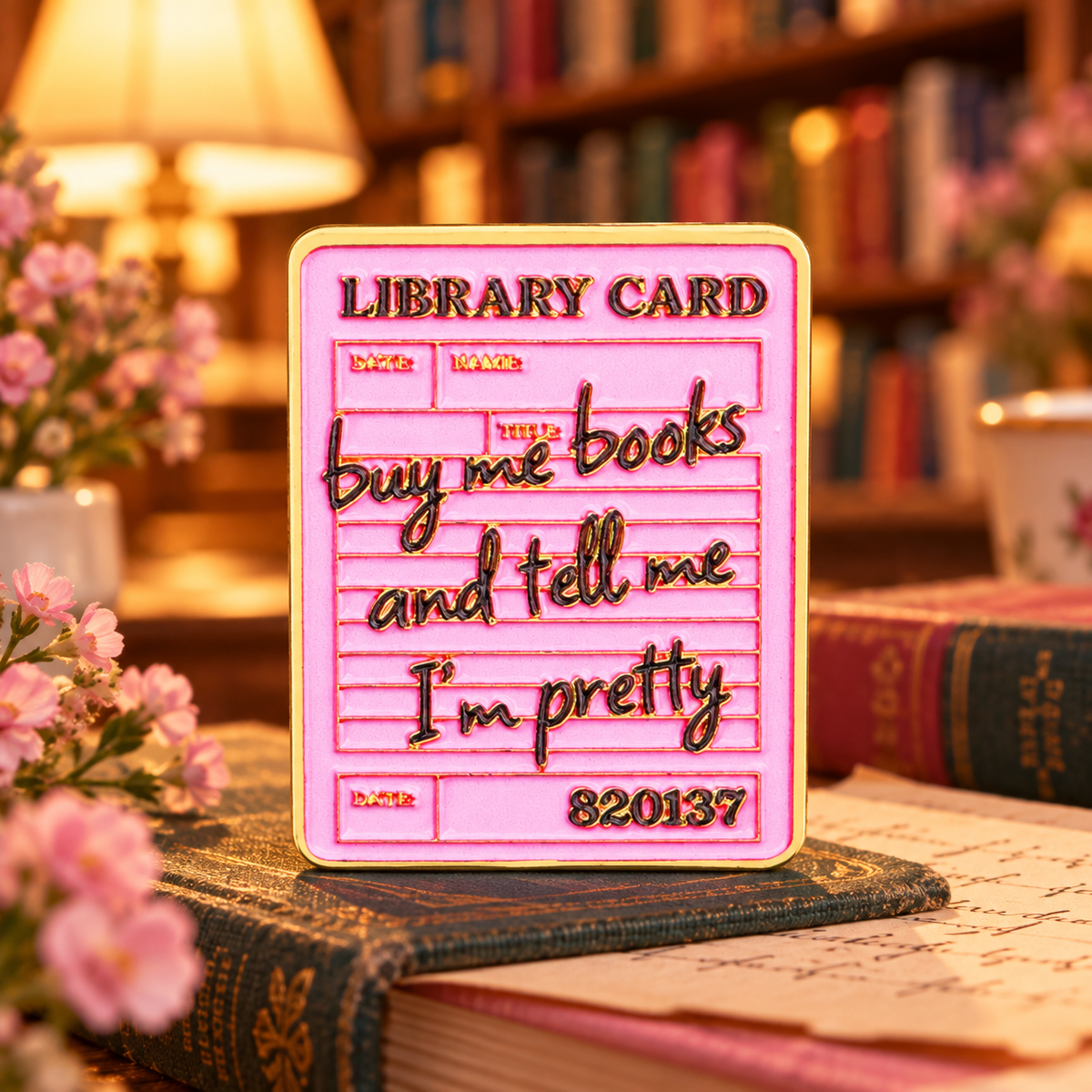Buy Me Books Library Card Pin in a cozy bookshop
