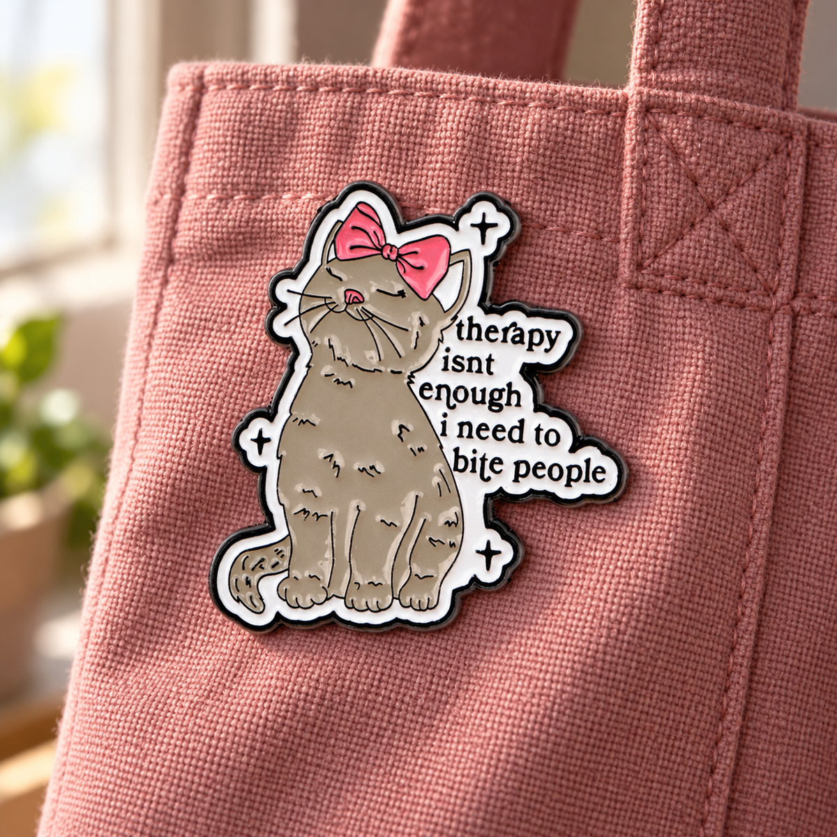 Cute Cat Therapy enamel pin on a dusty rose canvas tote