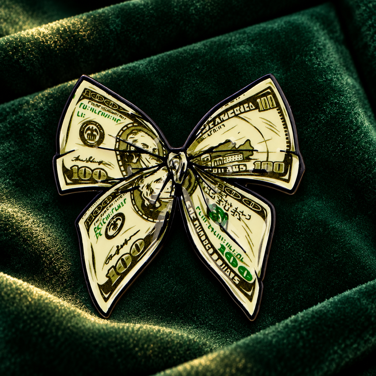 Dollar Bill Bow enamel pin on emerald velvet background