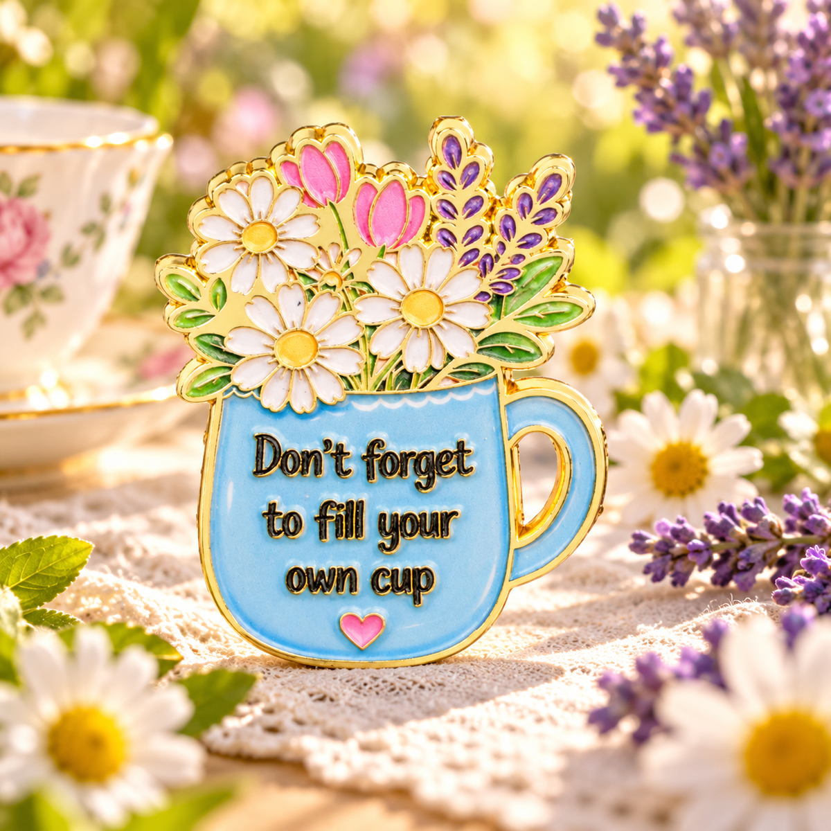 Don't Forget to Fill Your Own Cup Floral Pin on a sunny garden tea table