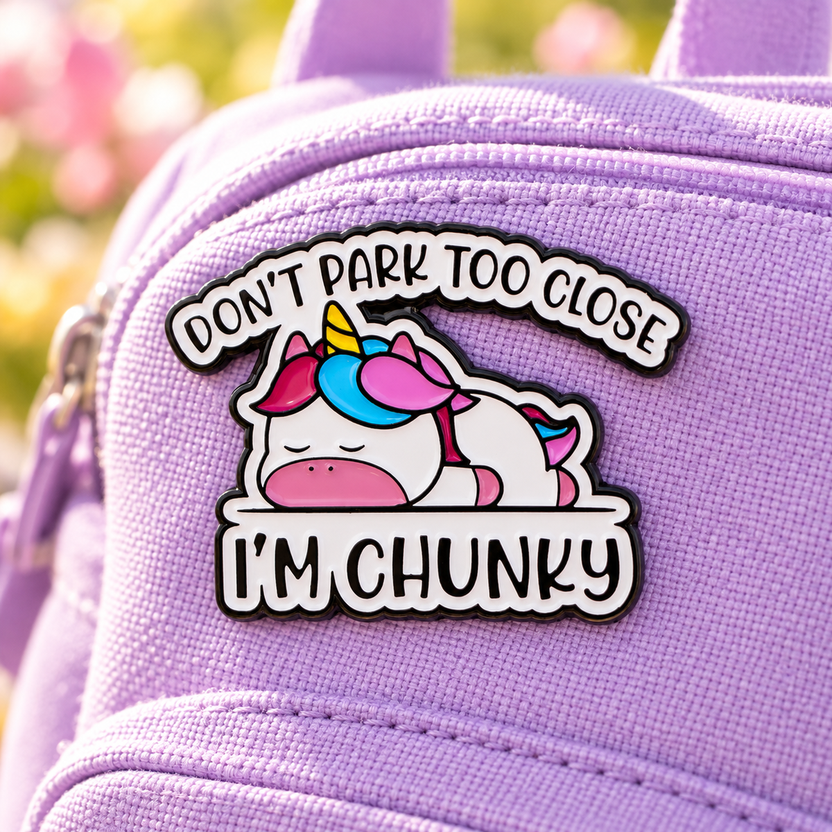 Don't Park Too Close I'm Chunky unicorn enamel pin on a lavender backpack