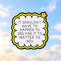 Empathy quote pin against a soft hopeful sky