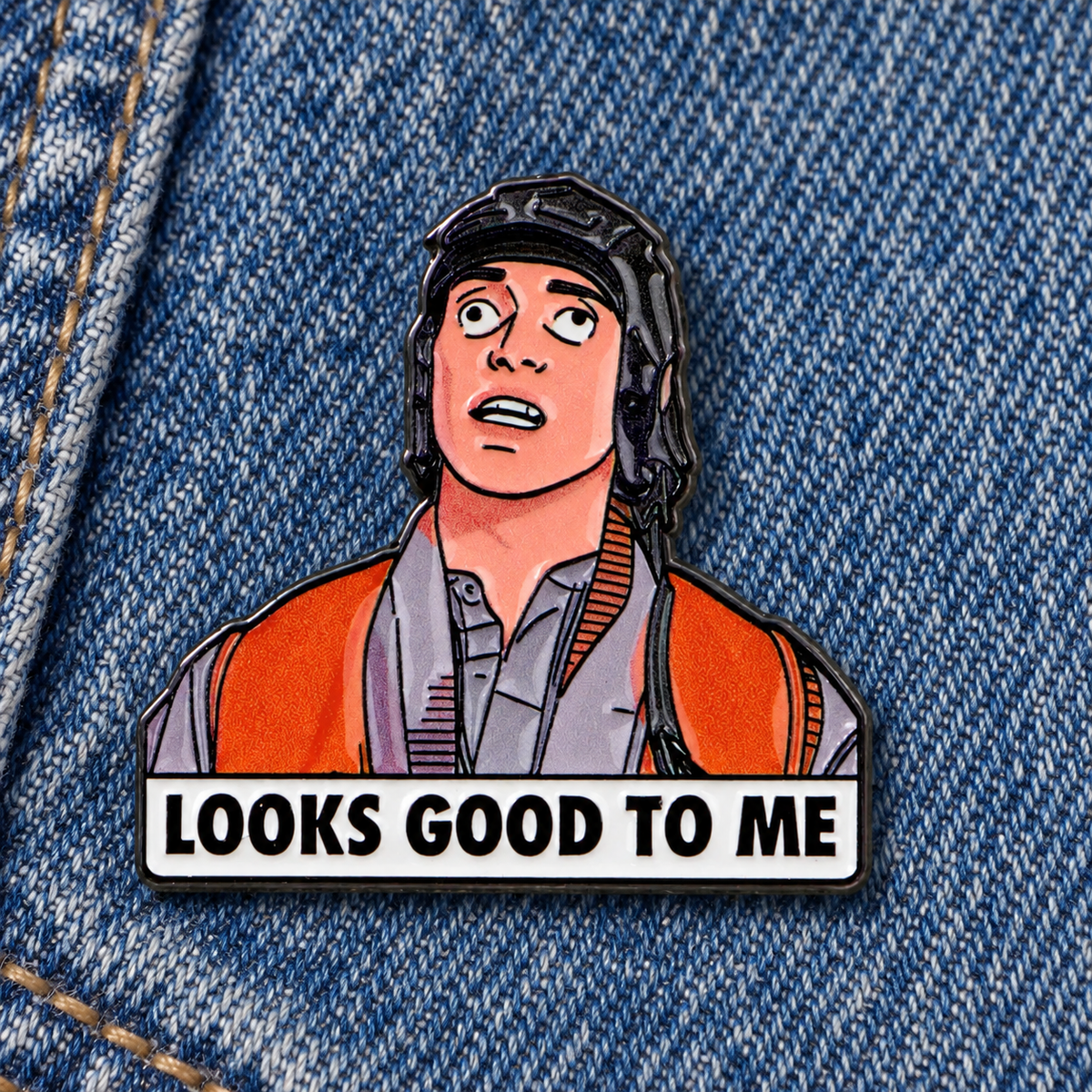 Looks Good to Me enamel pin on blue denim