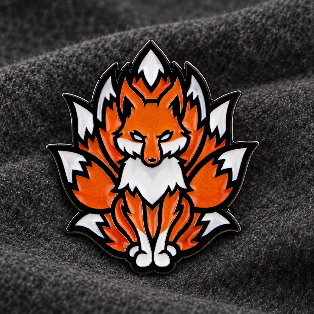 Ninetails orange fox enamel pin on charcoal felt