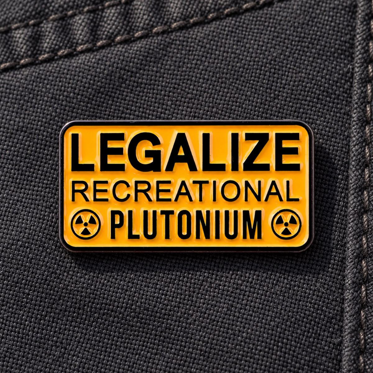 Legalize Recreational Plutonium enamel pin on dark canvas