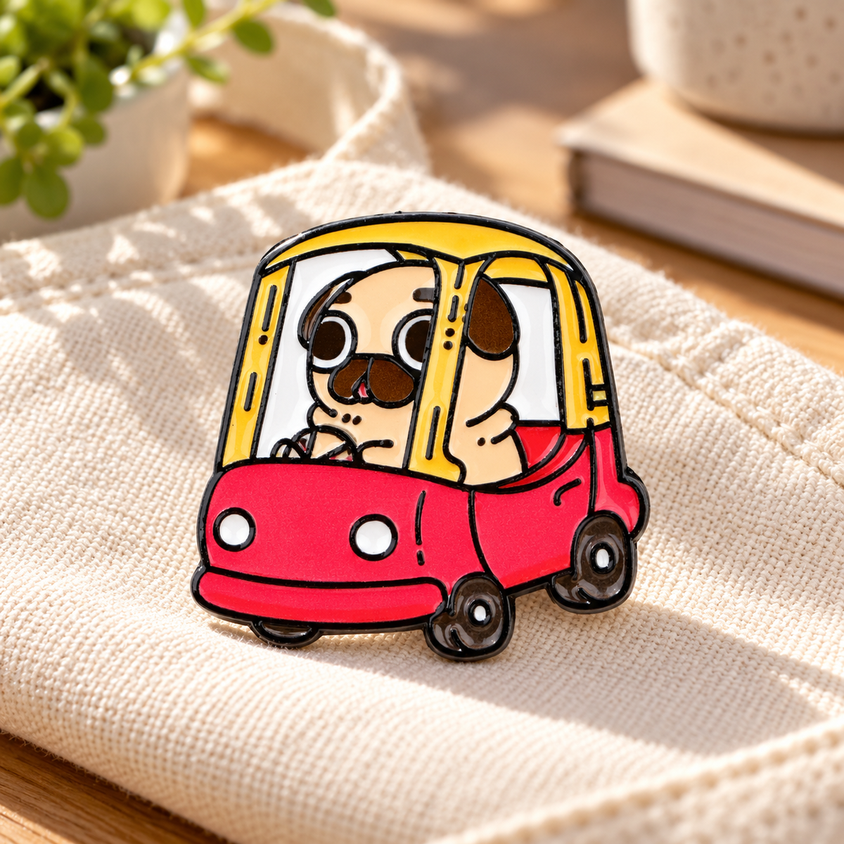 Puglie Puglie Pug Pin enamel pin on a cotton tote