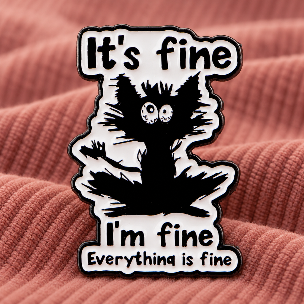It's Fine Everything Is Fine black cat enamel pin on dusty rose corduroy