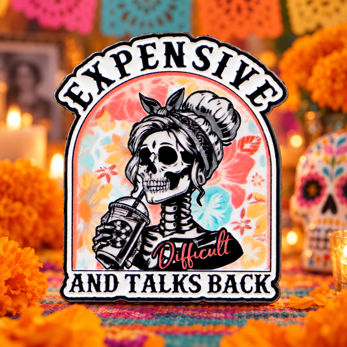 Expensive and Talks Back Día de Muertos Pin on a festive marigold altar