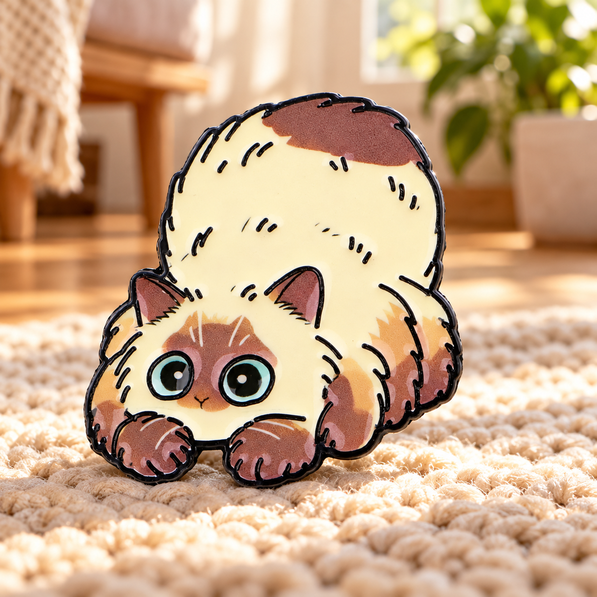 Fluffy Stretching Cat enamel pin on a cozy rug