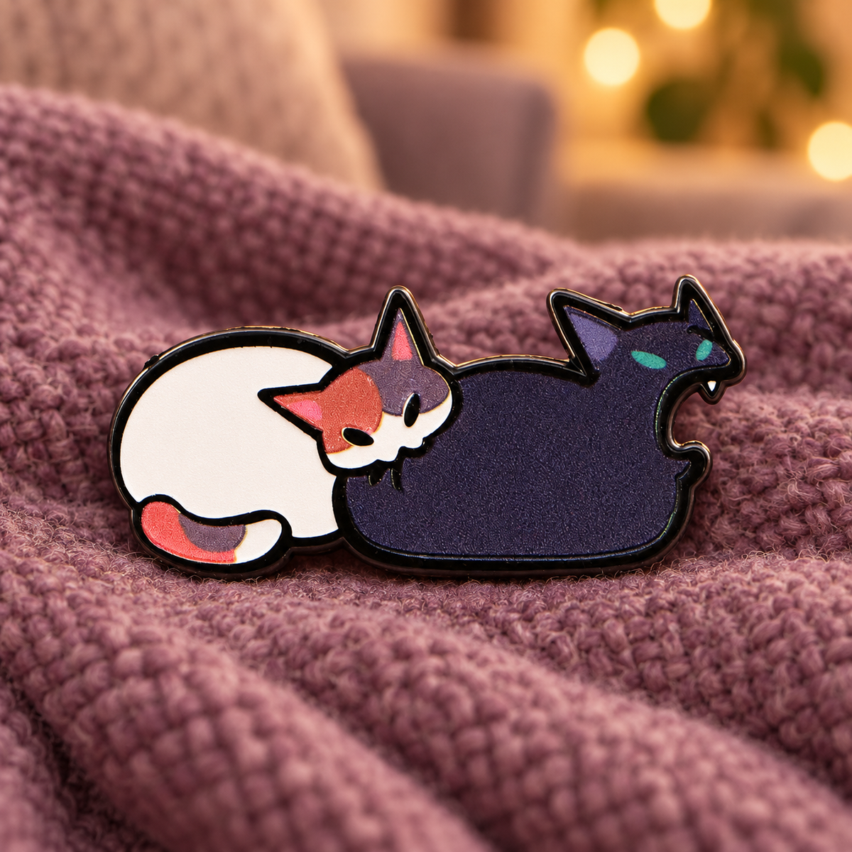 Funny Cat Bite Pin on a cozy mauve blanket