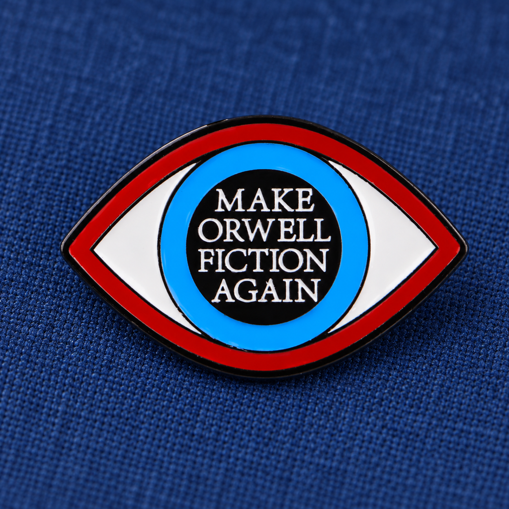 Make Orwell Fiction Again eye enamel pin on blue bookcloth