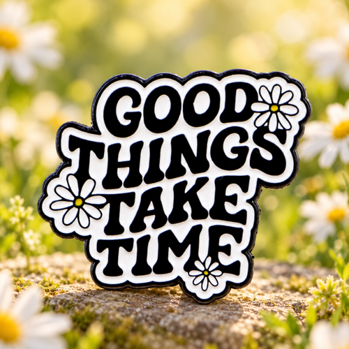 Good Things Take Time Daisy Pin in a sunny daisy garden