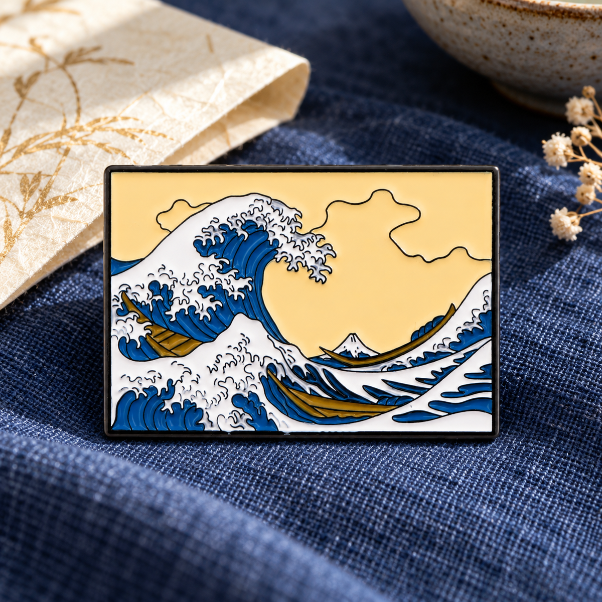The Great Wave off Kanagawa enamel pin on indigo linen
