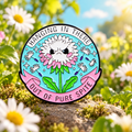 Hanging in There Out of Pure Spite Daisy enamel pin in a sunny garden