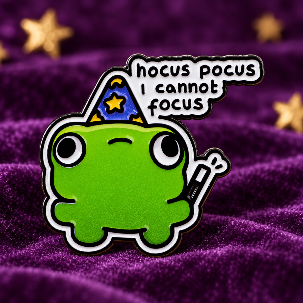 Hocus Pocus I Cannot Focus Frog Pin on a purple velvet background