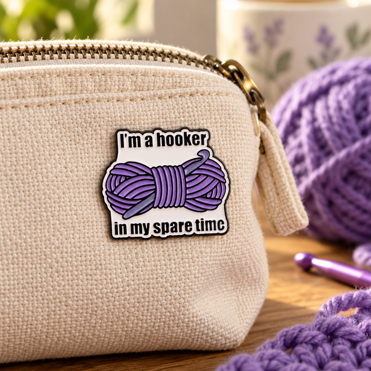 Crochet hooker enamel pin on a knitting project bag