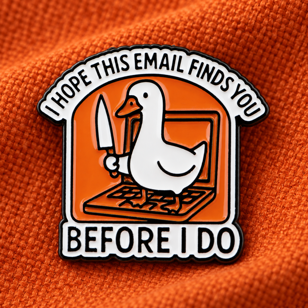 I Hope This Email Finds You Before I Do goose enamel pin on orange fabric