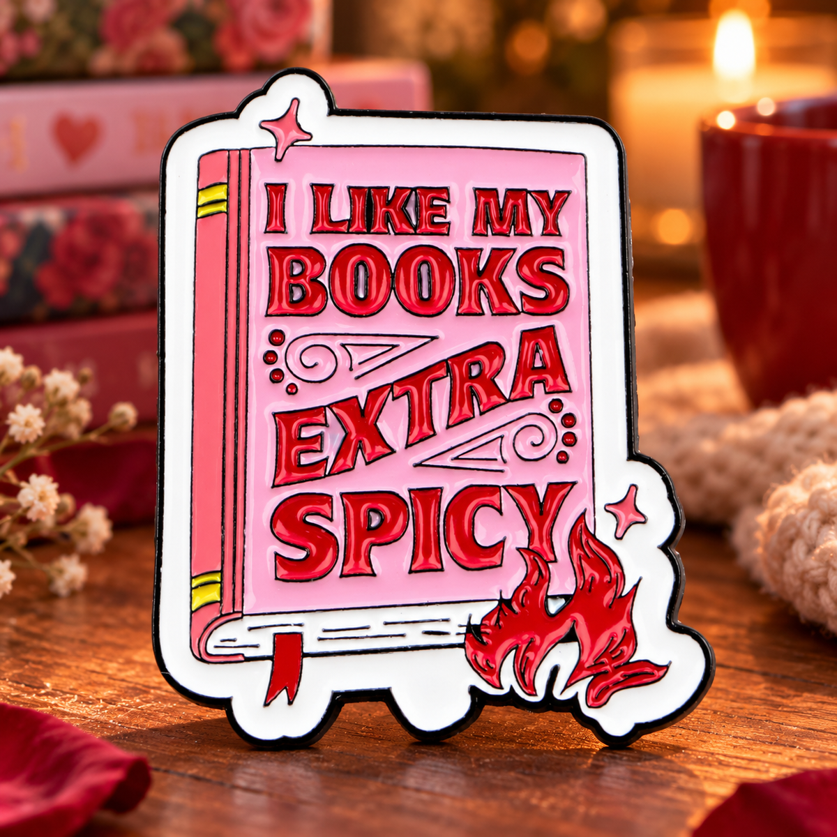 I Like My Books Extra Spicy enamel pin in a cozy romantic reading nook