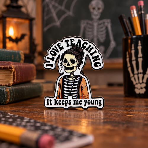 I Love Teaching It Keeps Me Young Skeleton Pin enamel pin on a themed background